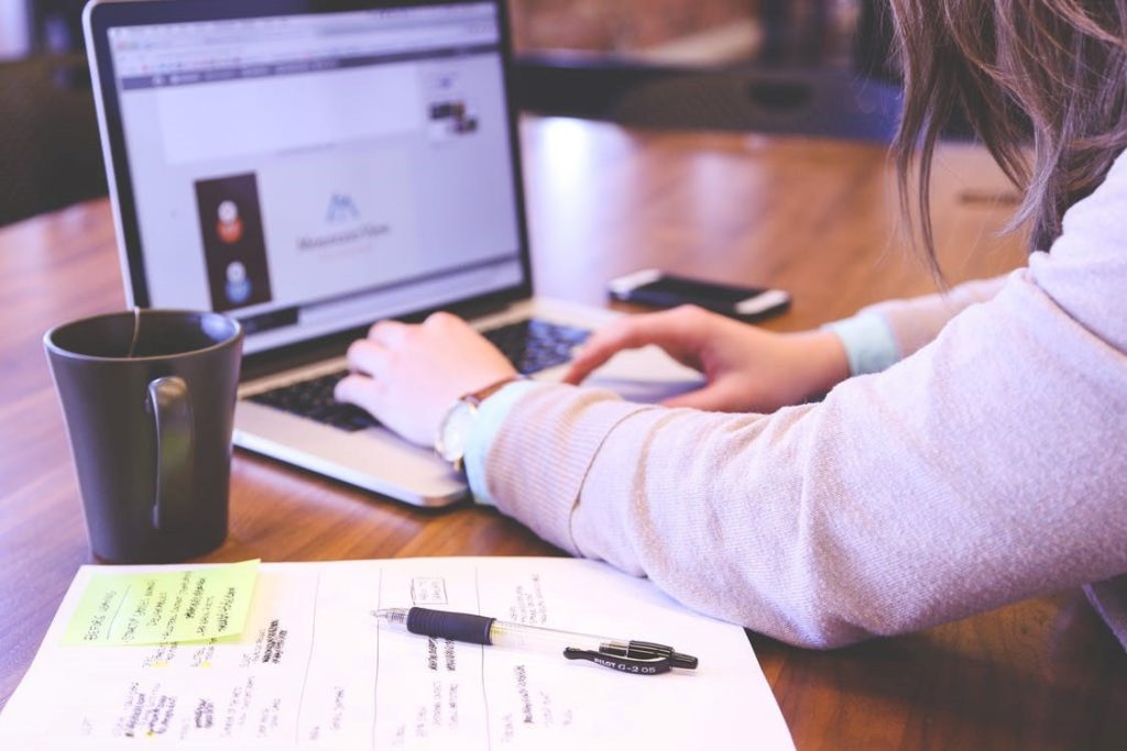 A marketing and branding agency employee works on copy.